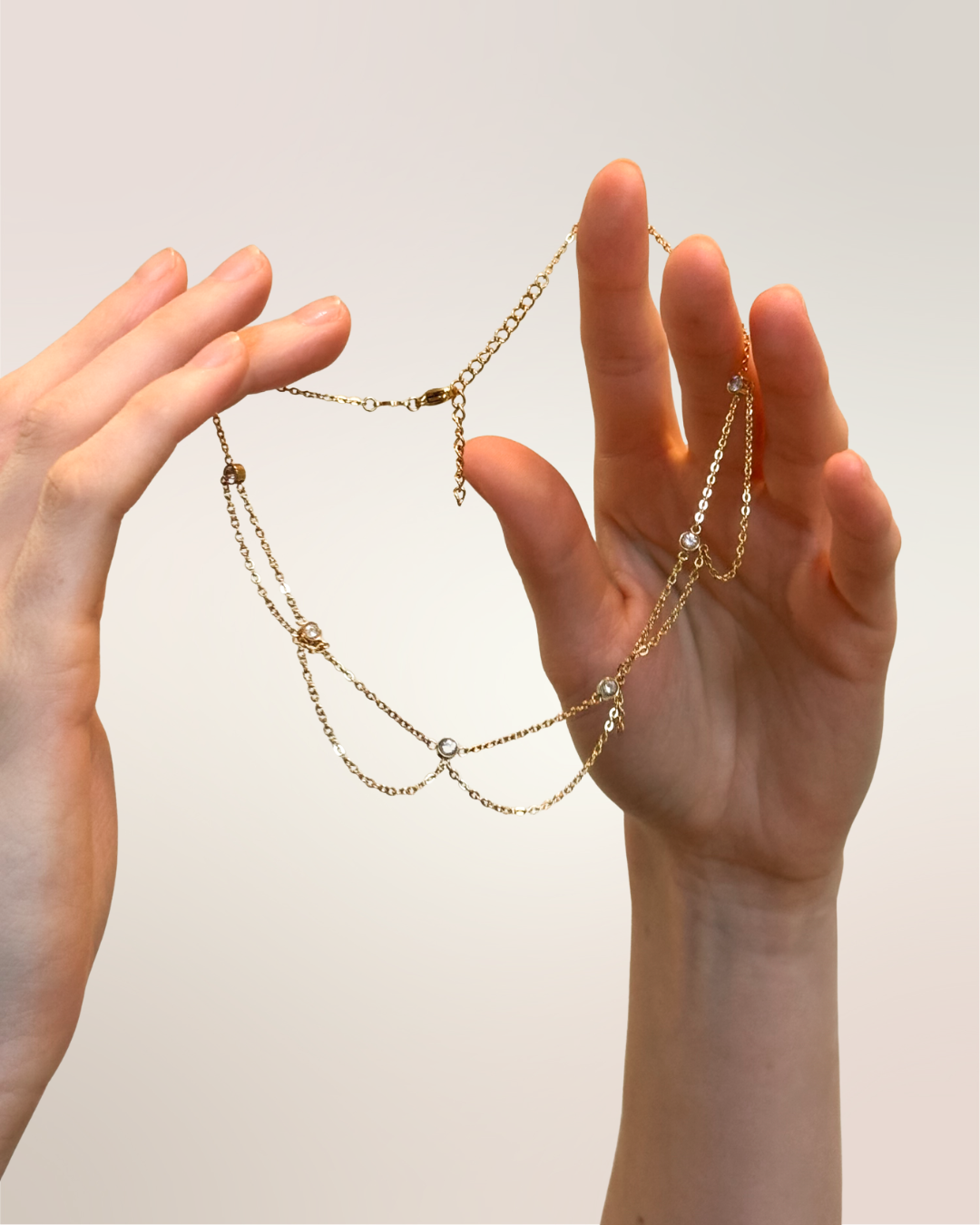 NECKLACE WITH GOLD LOOPS LINKED BY CZ BEZEL